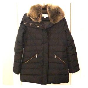Black, down Michael Kors winter coat. Never worn.